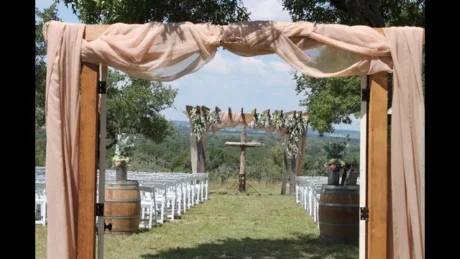 wedding tent on a grassy meaddow in a forrest