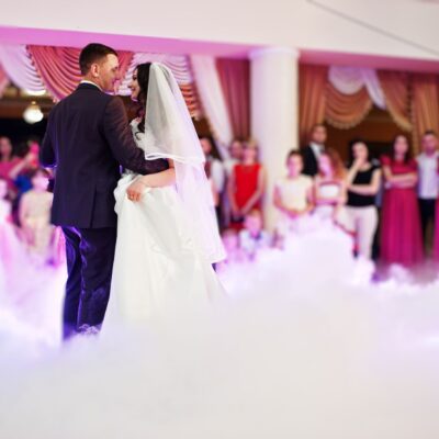 first wedding dance with smoke and rose purple lights.
